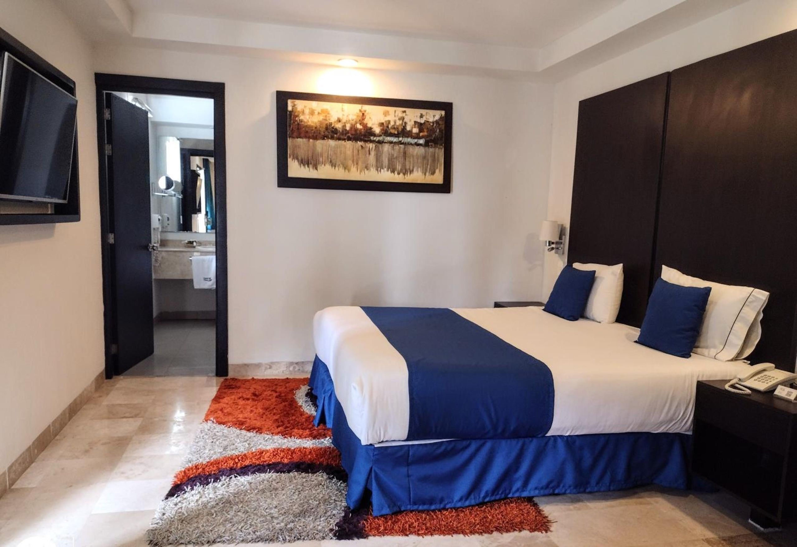 Habitación King con bañera de hidromasaje. — 2