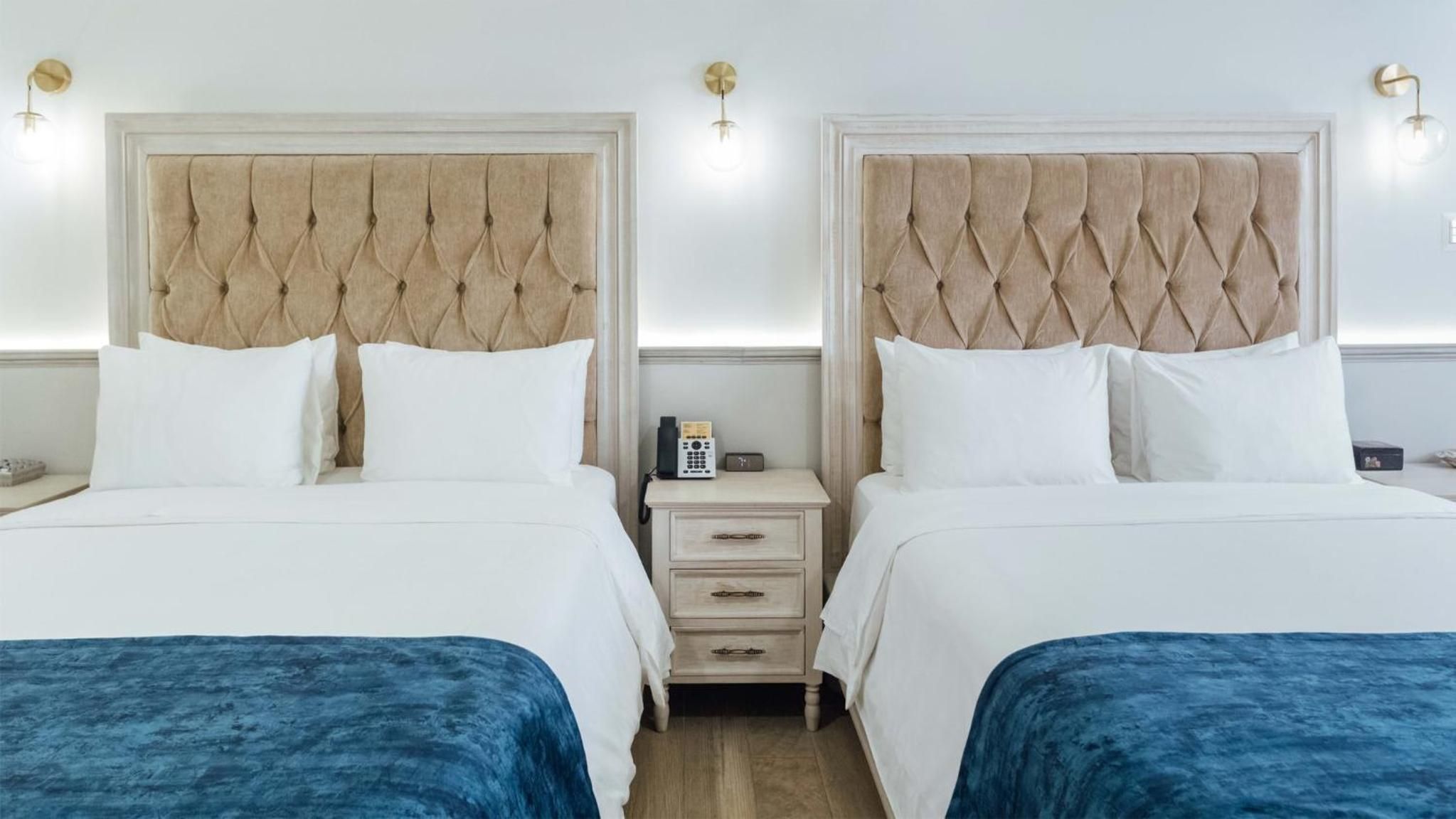 Suite Queen con Dos Camas Queen — 7