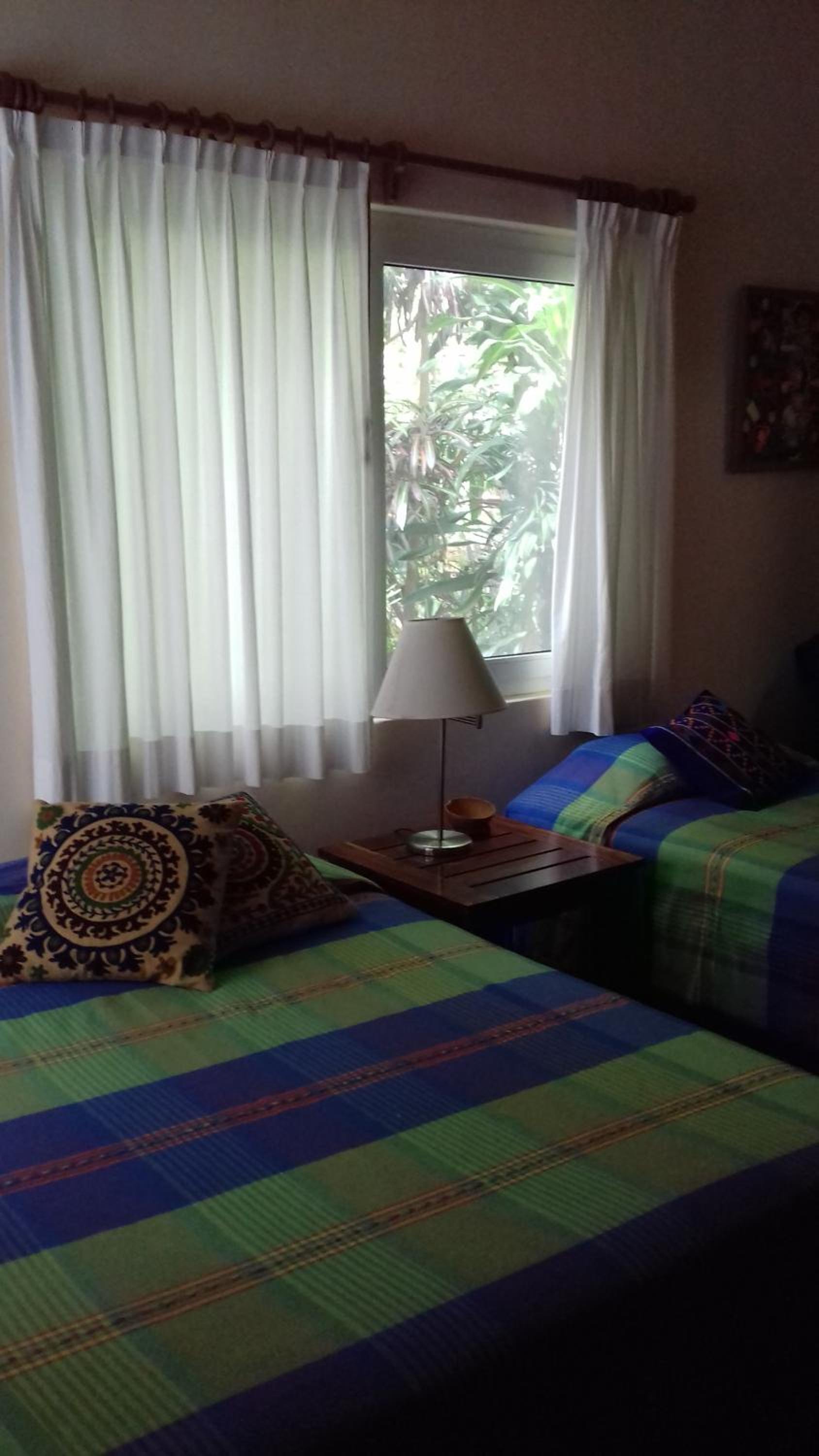 Habitación Triple con Vista al Jardín — 7