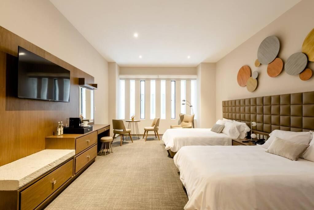 Habitación Doble Deluxe con Dos Camas Dobles