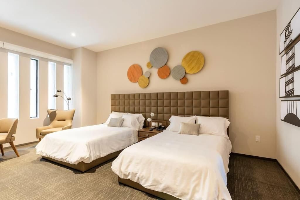 Habitación Doble Deluxe con Dos Camas Dobles — 6