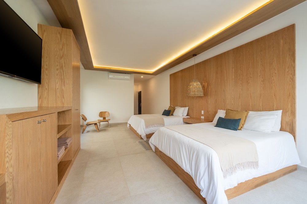 Deluxe Quadruple Room — 2